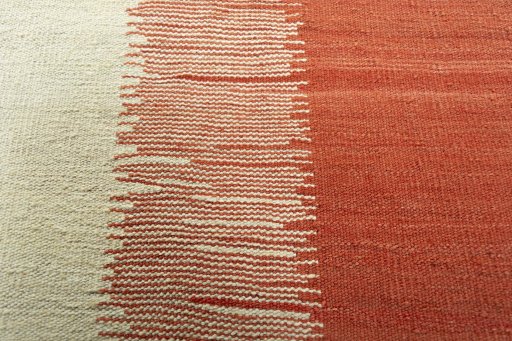 Backside of handmade New Modern Design rug showing knot structure and weave density