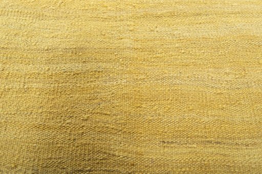 Backside of handmade New Modern Design rug showing knot structure and weave density
