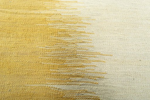 Backside of handmade New Modern Design rug showing knot structure and weave density