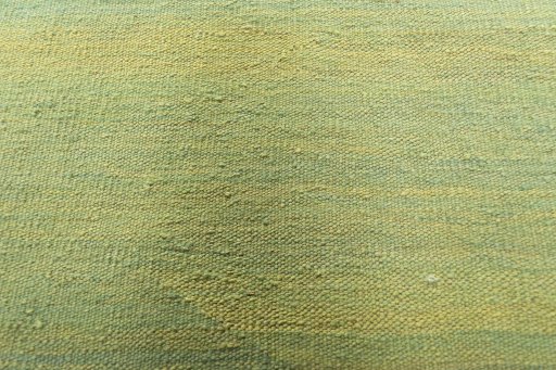 Backside of handmade New Modern Design rug showing knot structure and weave density