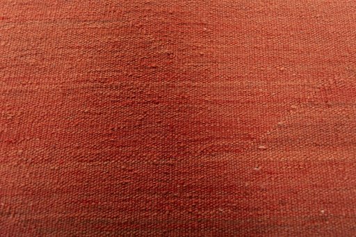 Backside of handmade New Modern Design rug showing knot structure and weave density
