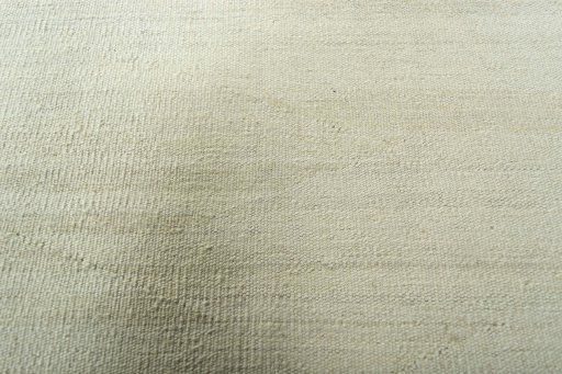 Backside of handmade New Modern Design rug showing knot structure and weave density
