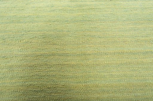 Backside of handmade New Modern Design rug showing knot structure and weave density