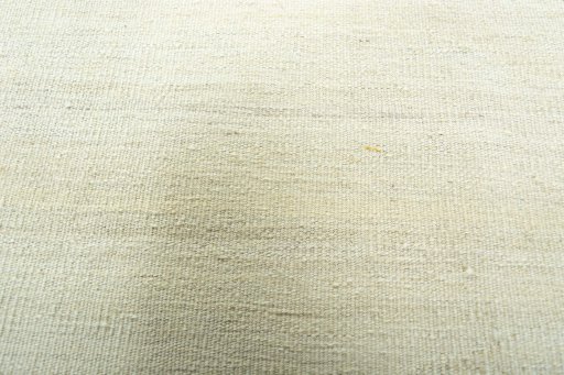Backside of handmade New Modern Design rug showing knot structure and weave density