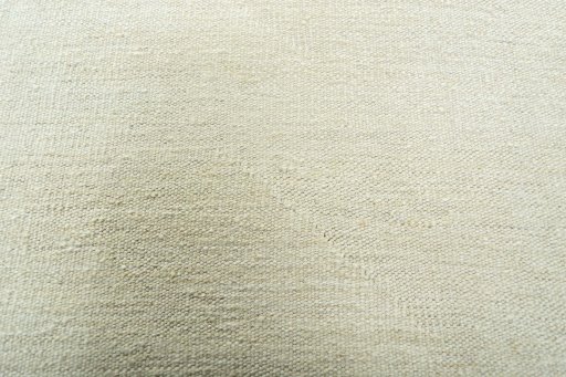 Backside of handmade New Modern Design rug showing knot structure and weave density