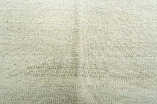 Backside of handmade New Modern Design rug showing knot structure and weave density