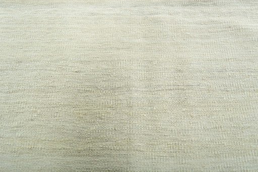 Backside of handmade New Modern Design rug showing knot structure and weave density