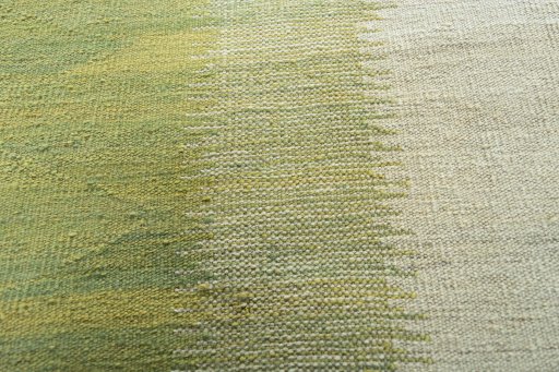 Backside of handmade New Modern Design rug showing knot structure and weave density