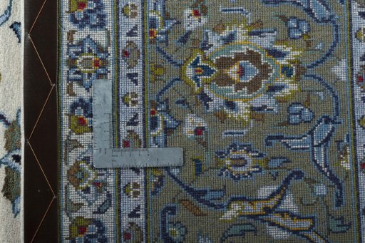 Backside of handmade 2000s Kashan rug showing knot structure and weave density