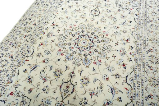 Backside of handmade 2000s Kashan rug showing knot structure and weave density