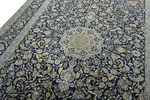 Backside of handmade New Kashan rug showing knot structure and weave density