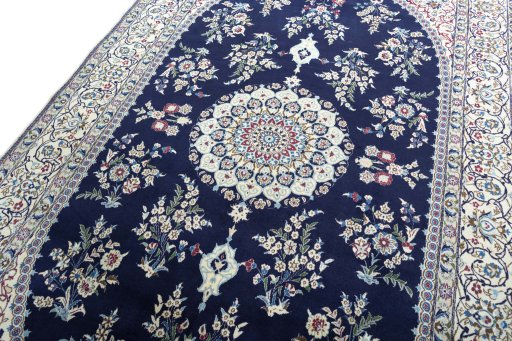 Backside of handmade 2000s Nain rug showing knot structure and weave density