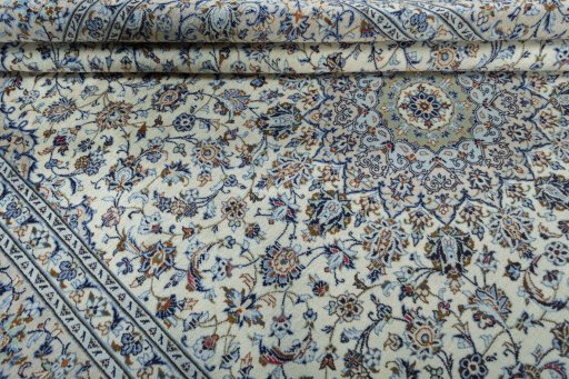 Close-up detail of 2000s Kashan rug from Iran / Persia showing Wool weave
