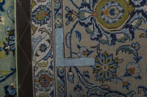 Backside of handmade 2000s Kashan rug showing knot structure and weave density