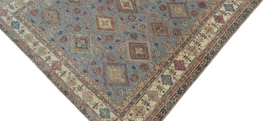 Backside of handmade New Kazak rug showing knot structure and weave density