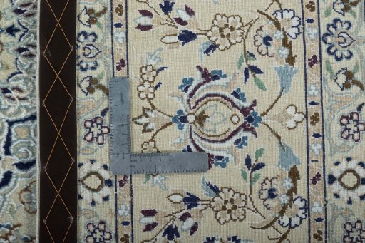 Backside of handmade 2000s Nain rug showing knot structure and weave density