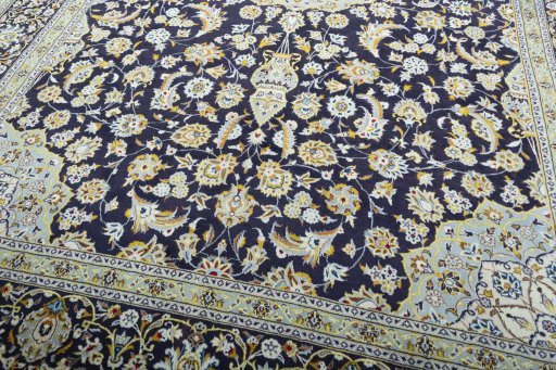 Close-up detail of 2000s Kashan rug from Iran / Persia showing Wool weave