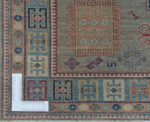 Corner detail of New Kazak rug showing border pattern and Wool pile