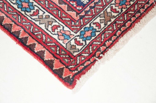 Backside of handmade New Abadeh rug showing knot structure and weave density