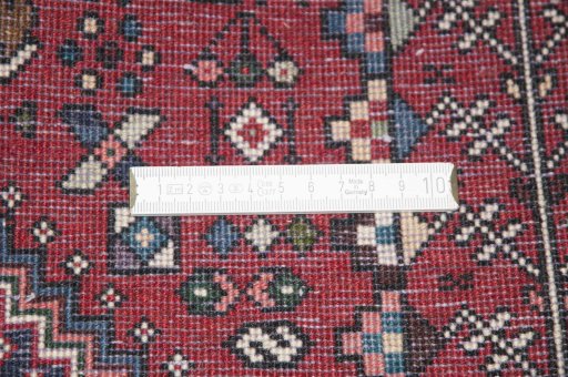 Backside of handmade New Abadeh rug showing knot structure and weave density