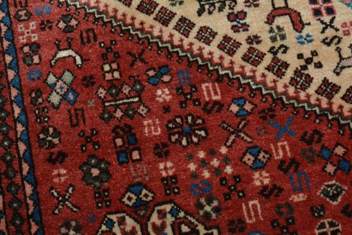 Backside of handmade 2000s Abadeh rug showing knot structure and weave density