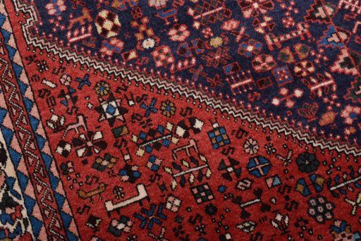 Surface texture of 2000s Abadeh rug with natural Wool and intricate pattern