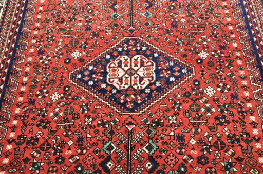 Surface texture of 2000s Abadeh rug with natural Wool and intricate pattern