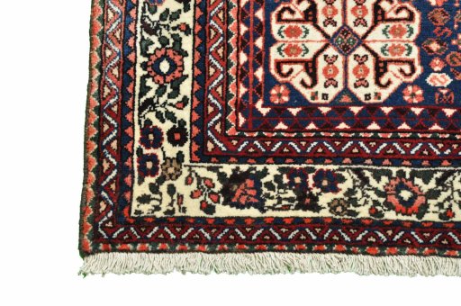 Backside of handmade 2000s Abadeh rug showing knot structure and weave density