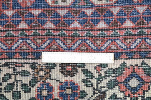 Close-up detail of 2000s Abadeh rug from Iran / Persia showing Wool weave