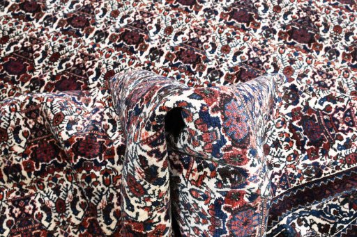 Corner detail of 1950s Abadeh rug showing border pattern and Wool pile