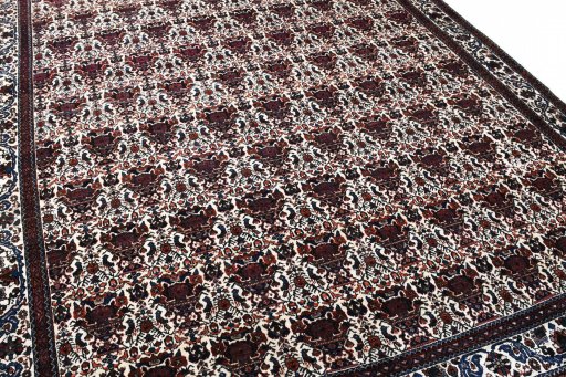 Surface texture of 1950s Abadeh rug with natural Wool and intricate pattern