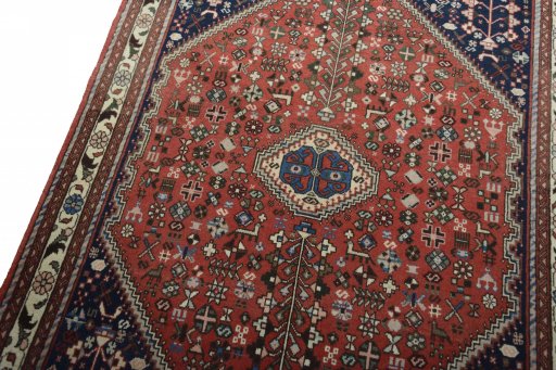Backside of handmade New Abadeh rug showing knot structure and weave density