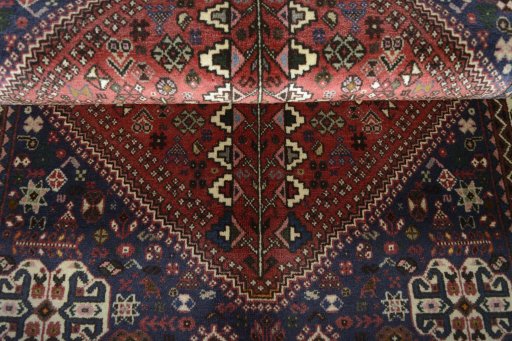Corner detail of 2000s Abadeh rug showing border pattern and Wool pile