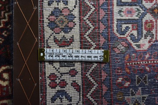Surface texture of 2000s Abadeh rug with natural Wool and intricate pattern