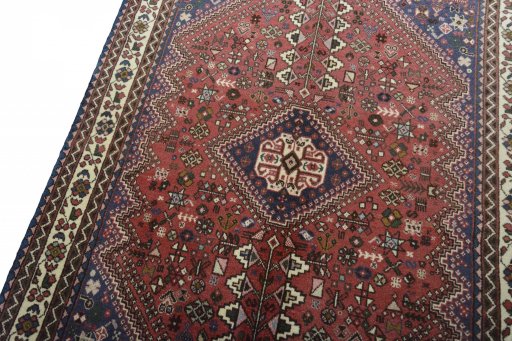 Backside of handmade 2000s Abadeh rug showing knot structure and weave density