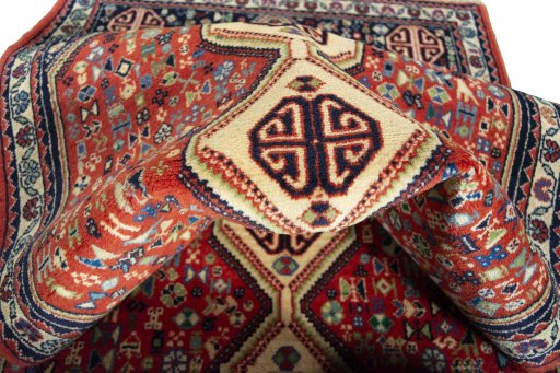 Corner detail of 2000s Abadeh rug showing border pattern and Wool pile