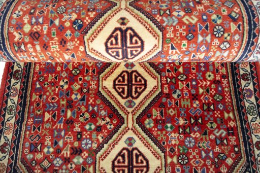 Full view of 2000s Abadeh rug from Iran / Persia, 204 × 83 cm in Red tones
