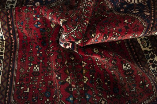 Corner detail of 2000s Abadeh rug showing border pattern and Wool pile