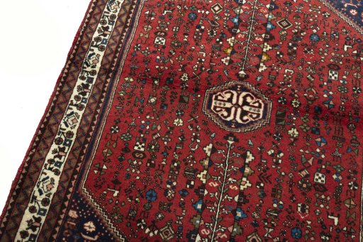 Backside of handmade 2000s Abadeh rug showing knot structure and weave density