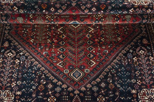 Corner detail of 1950s Abadeh rug showing border pattern and Wool pile