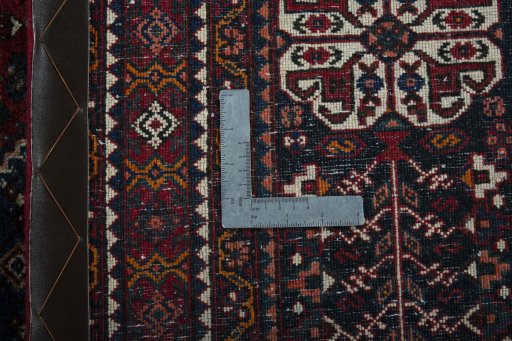 Surface texture of 1950s Abadeh rug with natural Wool and intricate pattern