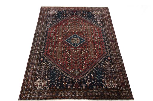Surface texture of 1950s Abadeh rug with natural Wool and intricate pattern