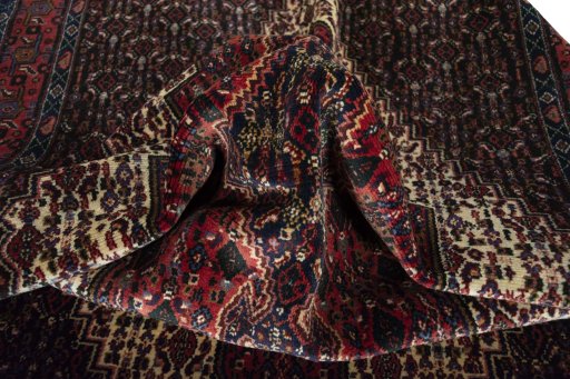 Corner detail of 1970s Afshar rug showing border pattern and Wool pile