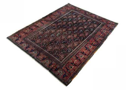 Corner detail of 1930s Afshar rug showing border pattern and Wool pile