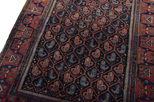 Backside of handmade 1930s Afshar rug showing knot structure and weave density