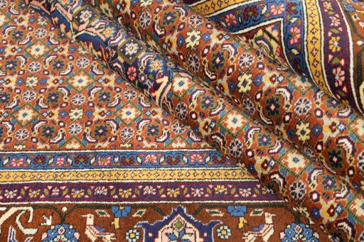 Close-up detail of 1990s Ardebil rug from Iran / Persia showing Wool weave