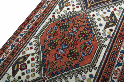Backside of handmade 2000s Ardebil rug showing knot structure and weave density