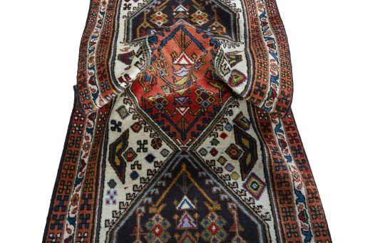 Corner detail of 2000s Ardebil rug showing border pattern and Wool pile