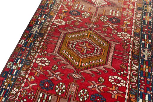 Backside of handmade 1950s Ardebil rug showing knot structure and weave density