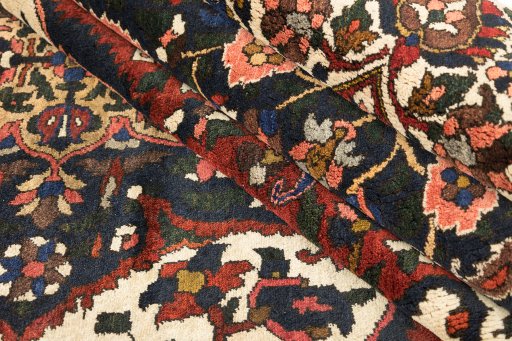 Corner detail of 1940s Bakhtiar rug showing border pattern and Wool pile